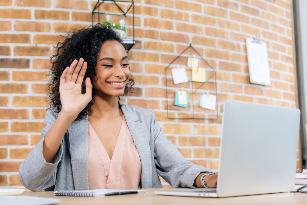 smiling african american Casual businesswoman using laptop while having Video Chat